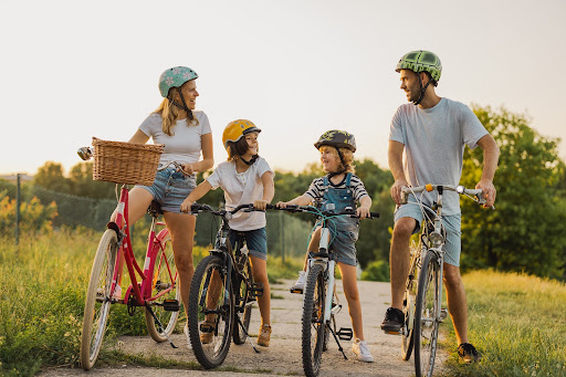 family of four riding bikes